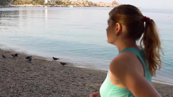 Young girl running on the beach slow motion — Stock Video