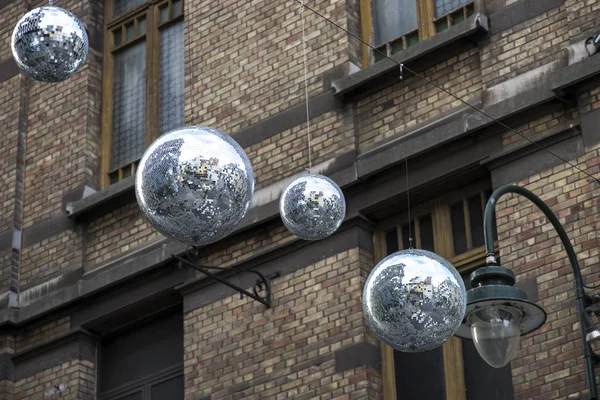 Christmas street decoration in the form of large shiny strobe balls — Stock Photo, Image