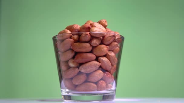 Raw brown nuts peanut rotates close-up macro — Stock Video