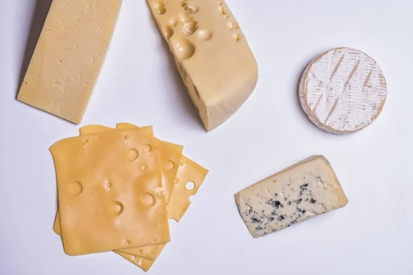 Different types of cheese on white background — Stock Photo, Image