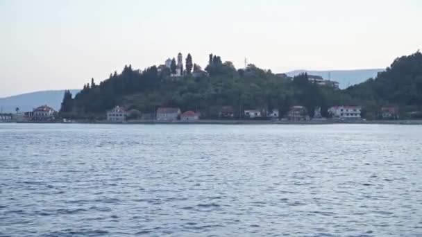 Kamenari, Montenegro. The Church on the hill at the entrance to Boka Bay — Stockvideo