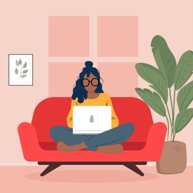 Flat vector illustration of a woman wearing glasses sitting cross-legged on a red sofa while using a laptop. Interior scene with a houseplant and wall art, representing remote work, online learning and home workspace concepts.
