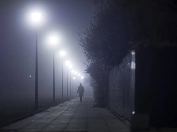 Silhouette Man Walking Stick Walking Foggy Street — Stock Photo, Image