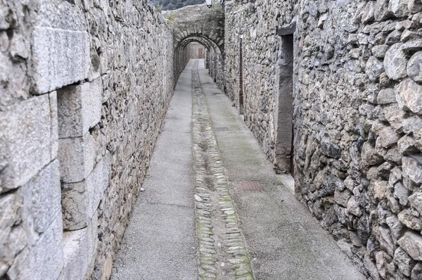 Ancient street of medieval village of Villefranche-de-Conflent, France.