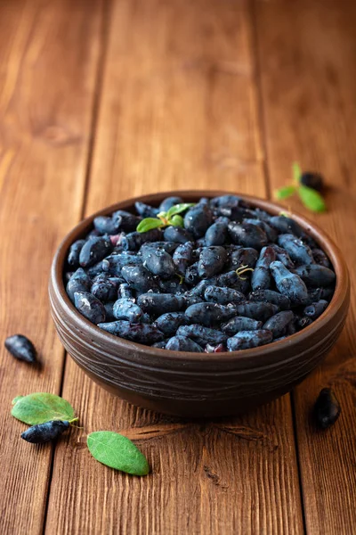 Honeysuckle Berries Lonicera Caerulea Ceramic Bowl Wooden Background Selective Focus — Stock Photo, Image