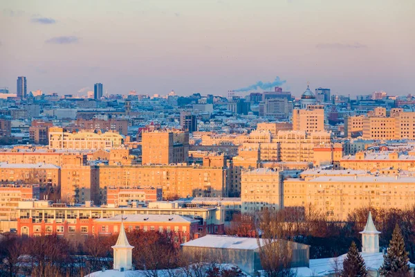 Panorama of Moscow at sunset. City skyline on winter day.