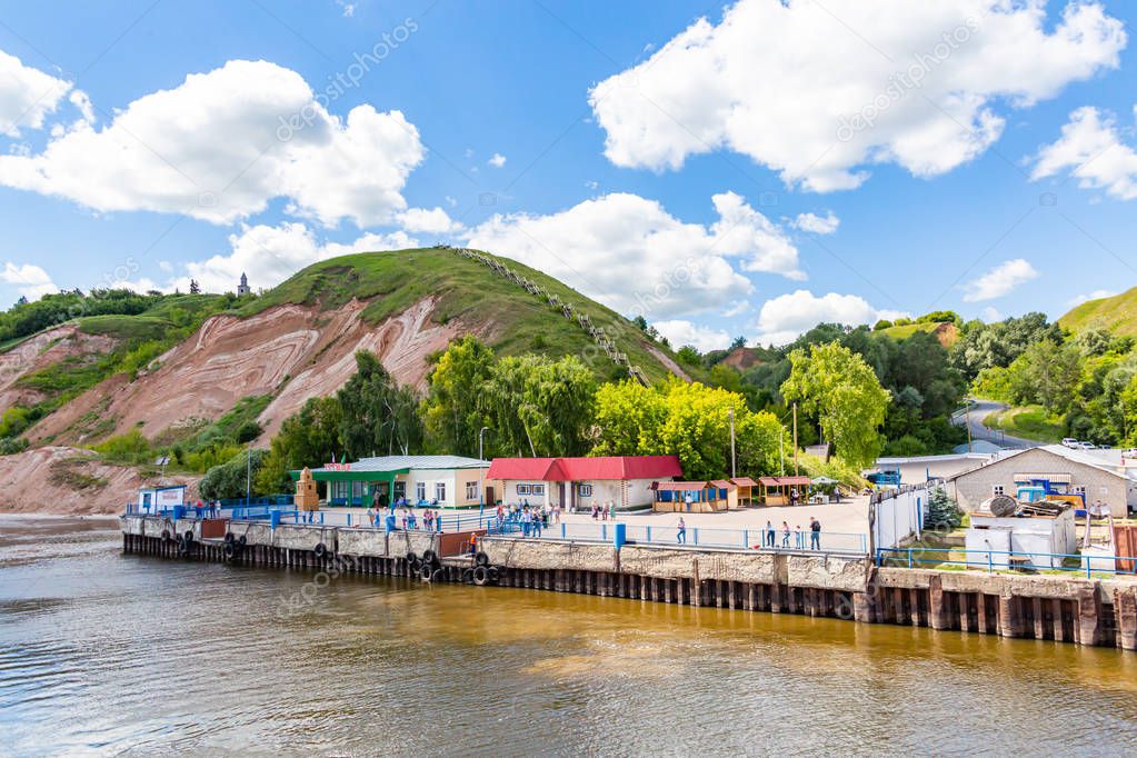 Pier on the Bank of the Volga river. Summer day. Tetyushi city in Tatarstan, Russia. Picturesque landscape.