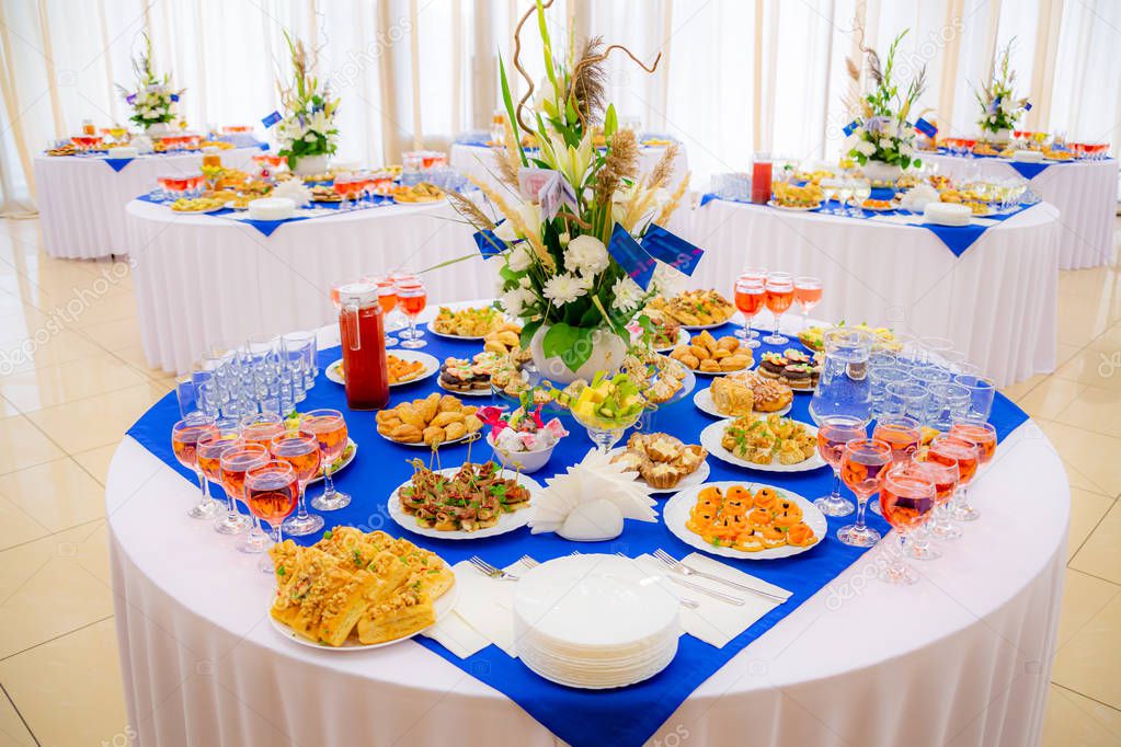 Festively laid tables at the Banquet. Various delicacies, snacks and drinks. Catering.