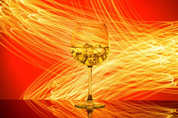 Glass Drink Ice Cubes Red Background Golden Lights — Stock Photo, Image