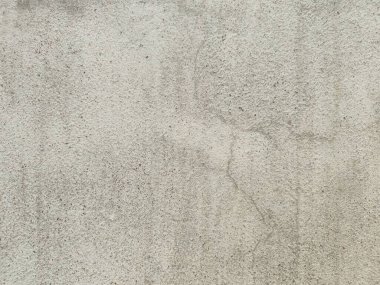Eski beton duvarın dokusu. Açık gri çimento desenli beton duvar. Gri pastel, sert, çatallı çimento, beton, taş, sıva, alçıdan duvar. Boyanmış arka plan..