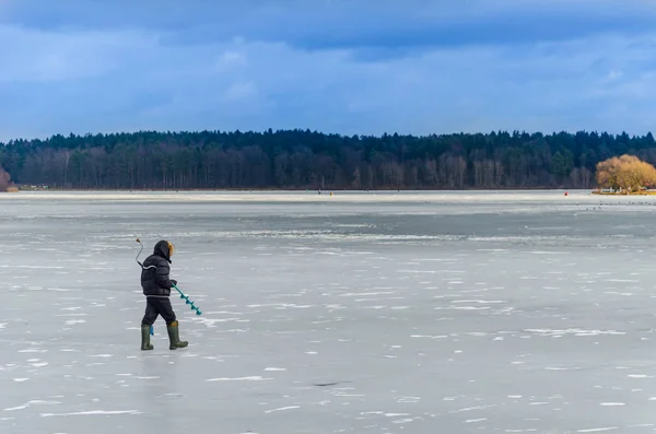 view of brave men on ice for winter fishing