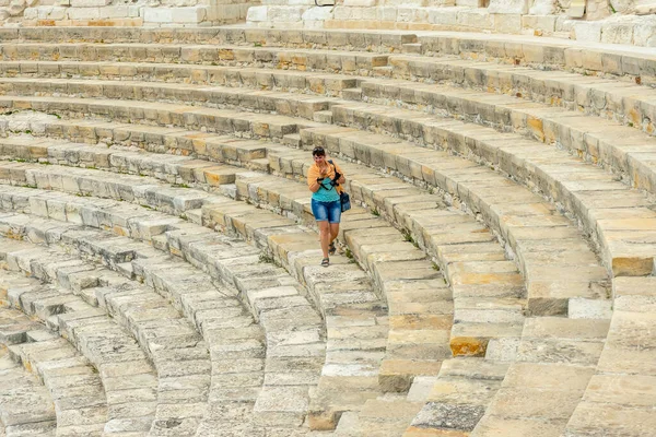 woman is in the ancient roman amphitheater in pamukkale