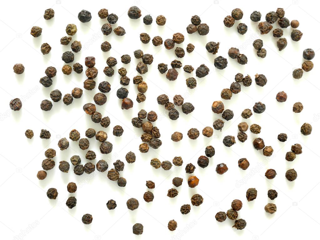 Pile of black peppercorns isolated on white background. Top view.