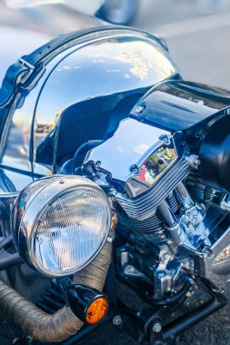 Close-up of vintage three-wheeled motor vehicle engine and headlights
