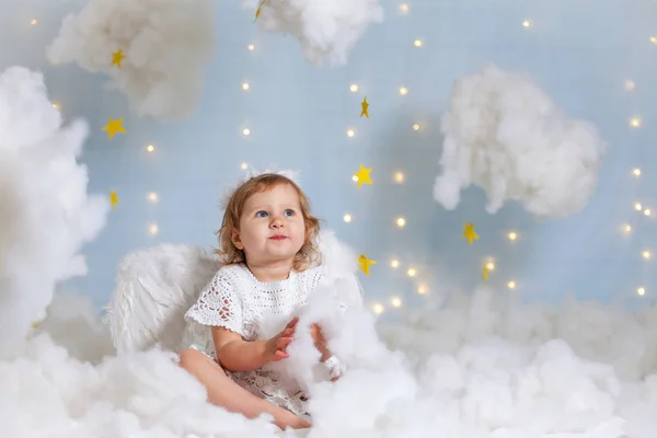 Baby Angel Sitting Clouds Looking Stock Image
