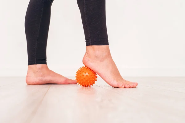 Low section of girl exercising with stress ball in hospital. mas