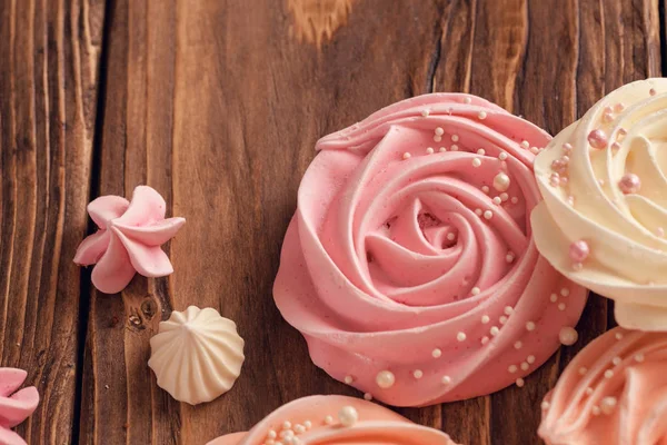 Meringue pale pink in the shape of a rose or flower. meringue is — Stock Photo, Image