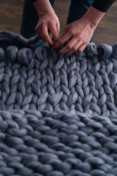 The process of knitting blankets made of Merino. blanket made of