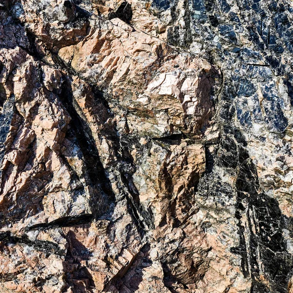 Teksturowanej powierzchni kamienia z wytłoczonym tłem. teksturowanej powierzchni — Zdjęcie stockowe