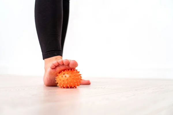 Low section of girl exercising with stress ball in hospital. mas