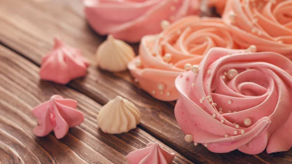 Meringue pale pink in the shape of a rose or flower. meringue is — Stock Photo, Image