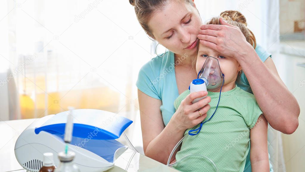 medicine on the table. the woman holds the child, checks the tem