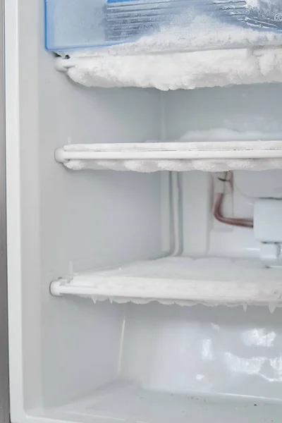 Ice in the freezer. icing cooling tubes. refrigerator requires d — Stock Photo, Image