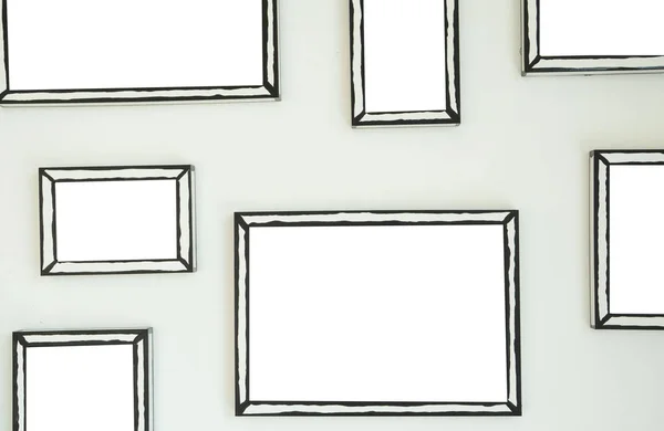 empty frame on white wall  .Blank space for text and images.