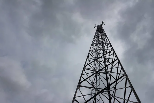 Signal telephone tower and storm.