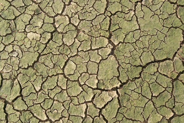 Seca, o solo rachaduras sem água quente falta de umidade top vie — Fotografia de Stock