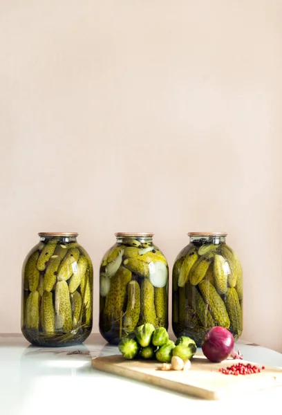 Three Cans Canned Pickled Cucumbers Table Next Fresh Cucumbers Onions — Stock Photo, Image