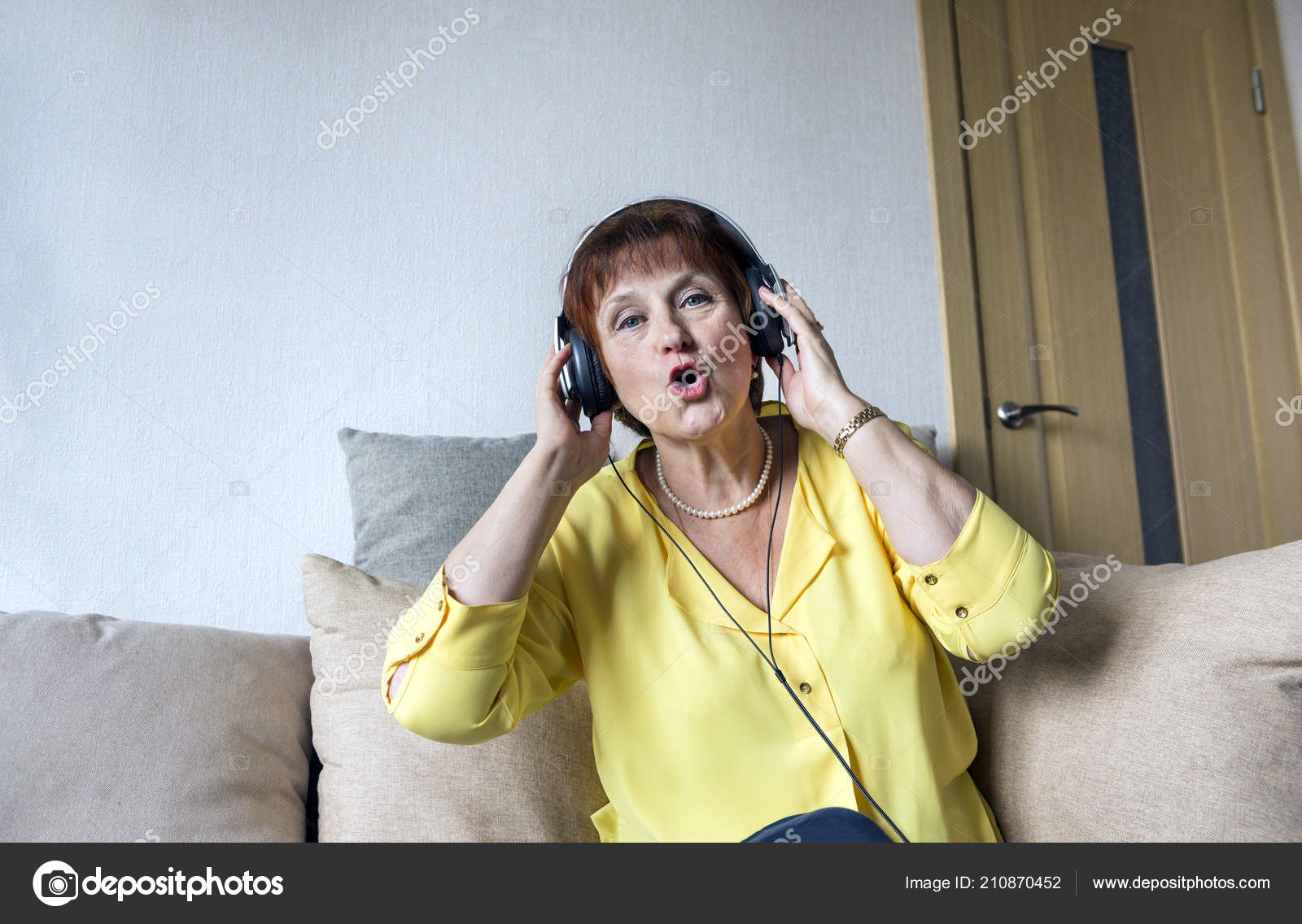 Adult White Woman Headphones Listening Music Singing Room
