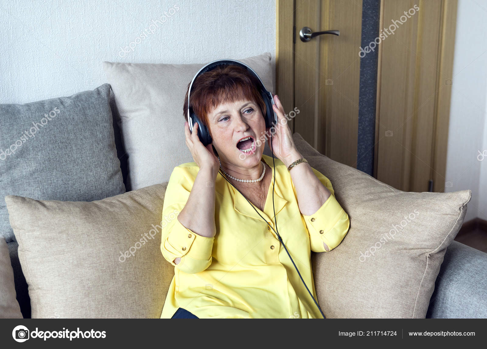 White Adult Woman Headphones Singing Listening Music Couch