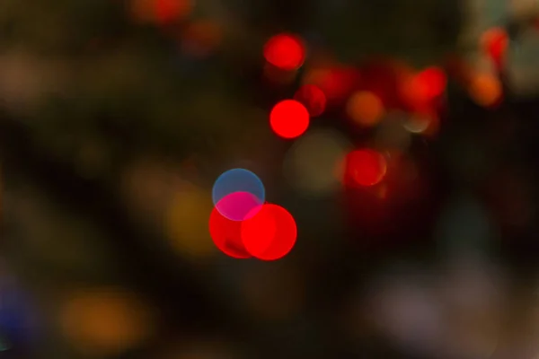 red, yellow light spots on dark background, blur spots
