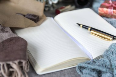 open Notepad, blank sheets of paper, pen, cloth, still life, writing space