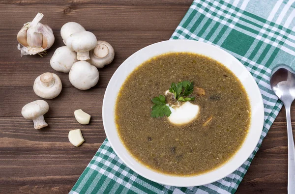 Mushroom soup with sour cream and herbs, mushrooms, towel in a g — Stock Image Mushroom soup with sour cream and herbs, mushrooms, towel in a g Royalty Free Stock Images