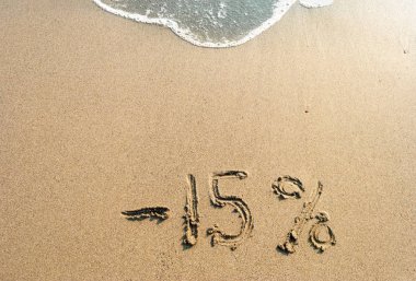 kum üzerinde yazıt eksi yüzde 15, %15, deniz dalgası üzerinde 