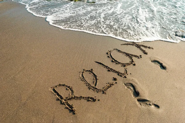 Iscrizione sulla sabbia, relax, spiaggia, vacanza — Foto Stock