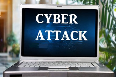 the words cyber attack on a computer laptop