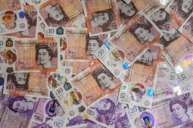 Çoklu İngiliz 10 sterlin banknotlar yakın plan, finans, ticaret ve para konsepti makro arka plan.