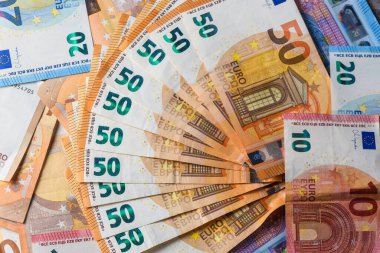 Elli avroluk banknotların Macro görünümü tasarruf, ticaret ve mali konsepti temsil ederek diğer avro banknotlarına da yansıdı.