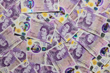 20 İngiliz sterlin banknotları, finans, tasarruf, ticaret ve İngiltere ekonomisini sembolize eden bir para arkaplanı oluşturmaktadır.