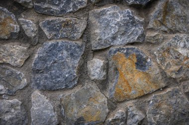 Kıbrıs Rum Kesimi 'nin kırsal doğal taş duvarına yakın çekim. Posterler, yaratıcı projeler ve Akdeniz temaları için sanatsal dokulu arka plan.