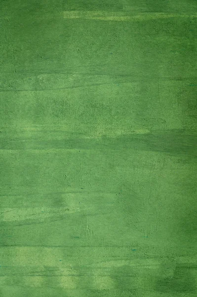 Yeşil boyalı bir duvarın yakın çekimi, tasarım, iç mekan ve arkaplan boyası için mükemmel bir arka plan. Yüksek kalite fotoğraf