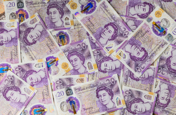 Британские банкноты весом 20 фунтов стерлингов сфотографированы крупным планом, представляющим финансовый рынок, валютную биржу и экономическую концепцию.