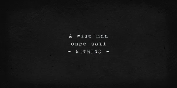 A wise man once said nothing. Powerful and dramatic quote. Text art illustration, typewriter font on old black paper background. Inspirational and motivational words, minimalist lettering composition.