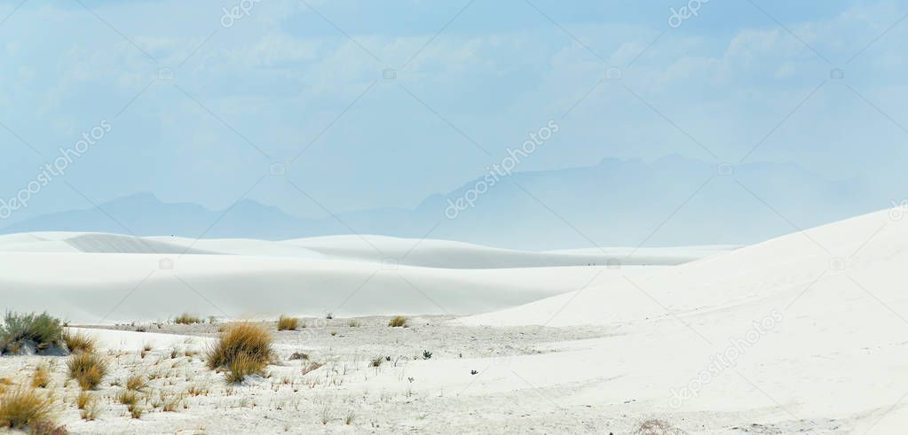 White sand dunes with mountains in the background in southern New Mexico
