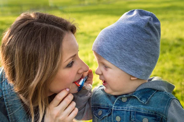 Mom Pacifier Her Mouth Looks Her Child Close Portrait — Stock Photo, Image