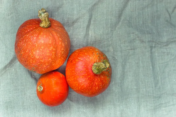 Three Mini Pumpkins Linen Fabric Thanksgiving Holiday Concept — Stock Photo, Image