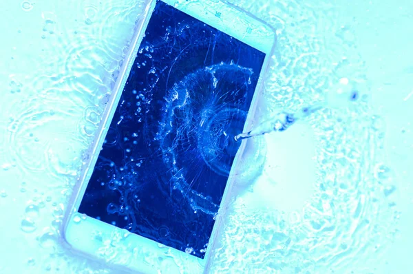 Phone in water close up. Concept broken phone. Copy space